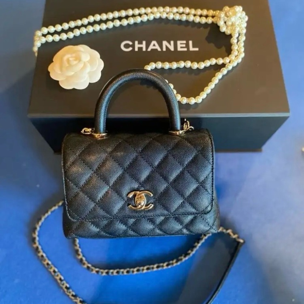 Chanel Black Quilted Mini Bag with Gold Accents